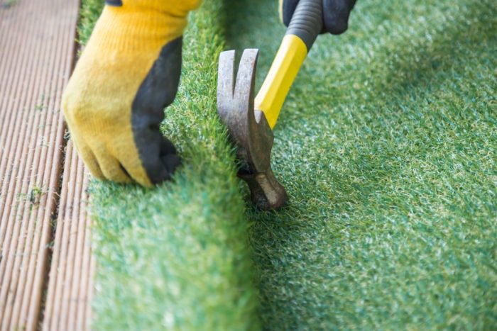 Artificial grass installation on patio