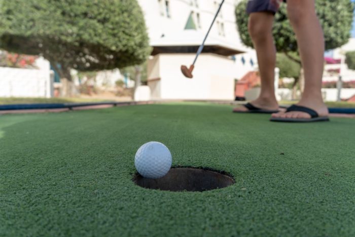 Putting in backyard putting green