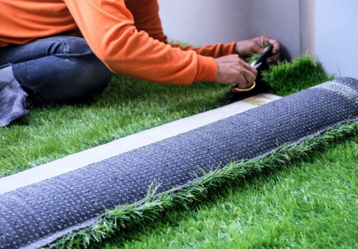 Installing artificial grass in backyard